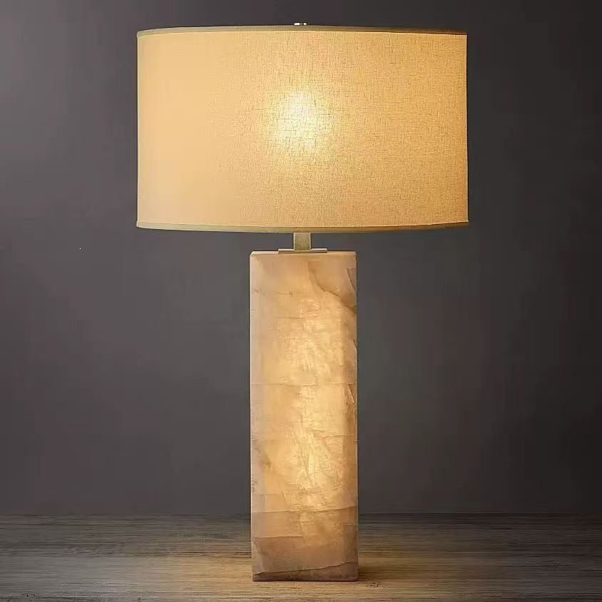 Cloud stone rectangular bedside table lamp glowing warmly