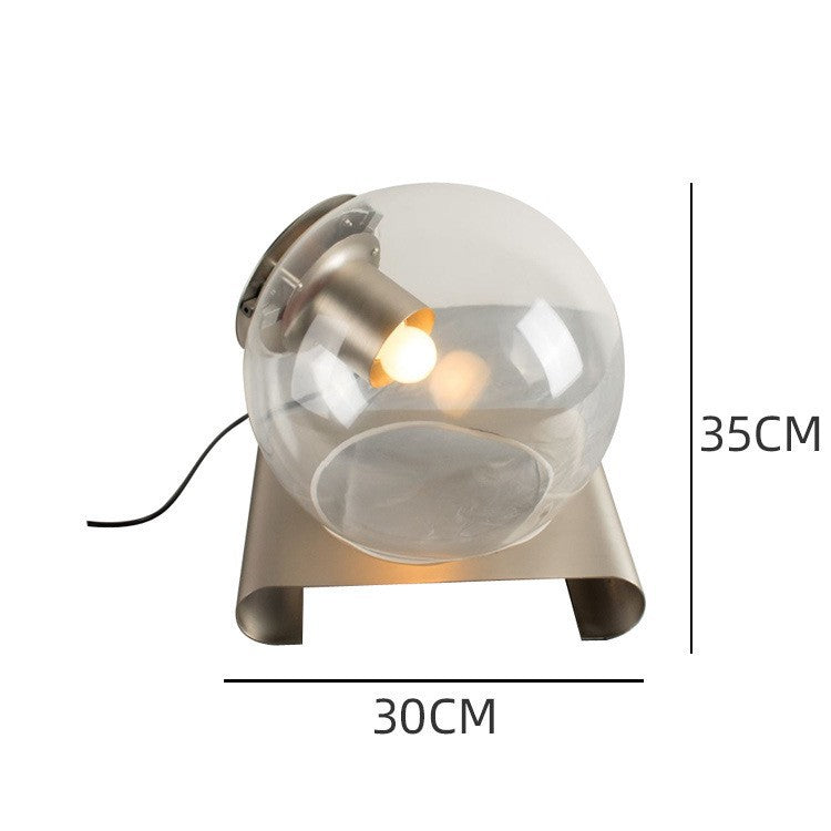 Modern smoked glass orb bedside lamp front view