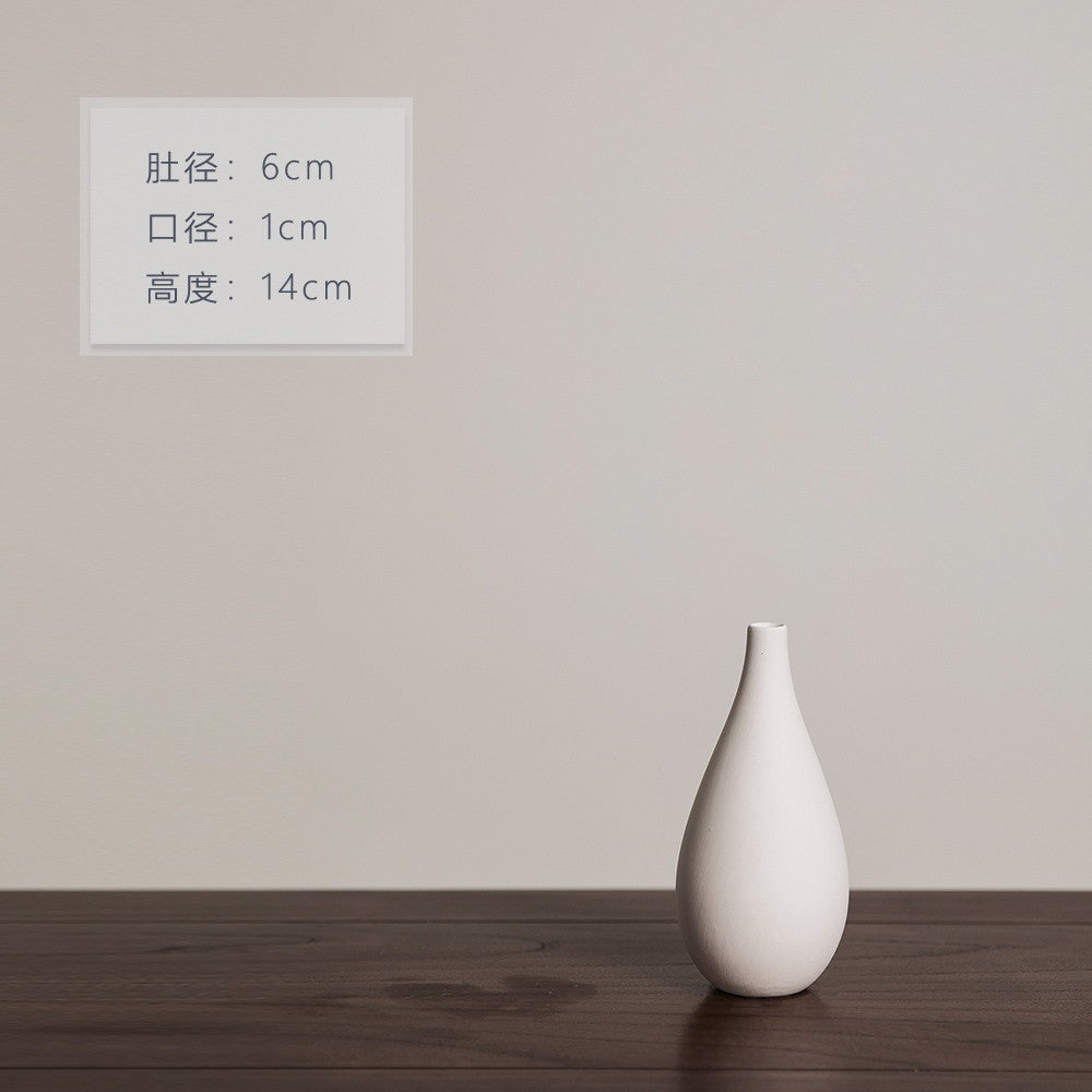 Matte ivory droplet-shaped ceramic bud vase, 14 cm high