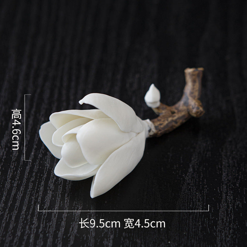 White ceramic magnolia incense holder measuring 9.5 by 4.5 by 4.6 cm