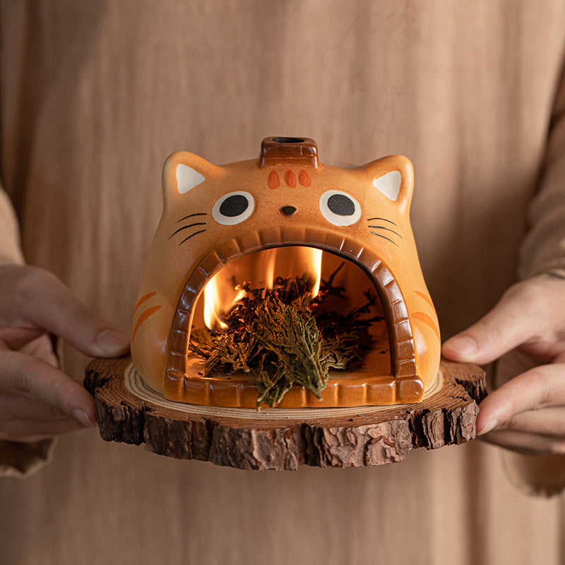 Orange cat ceramic sage burner with flame inside front chamber