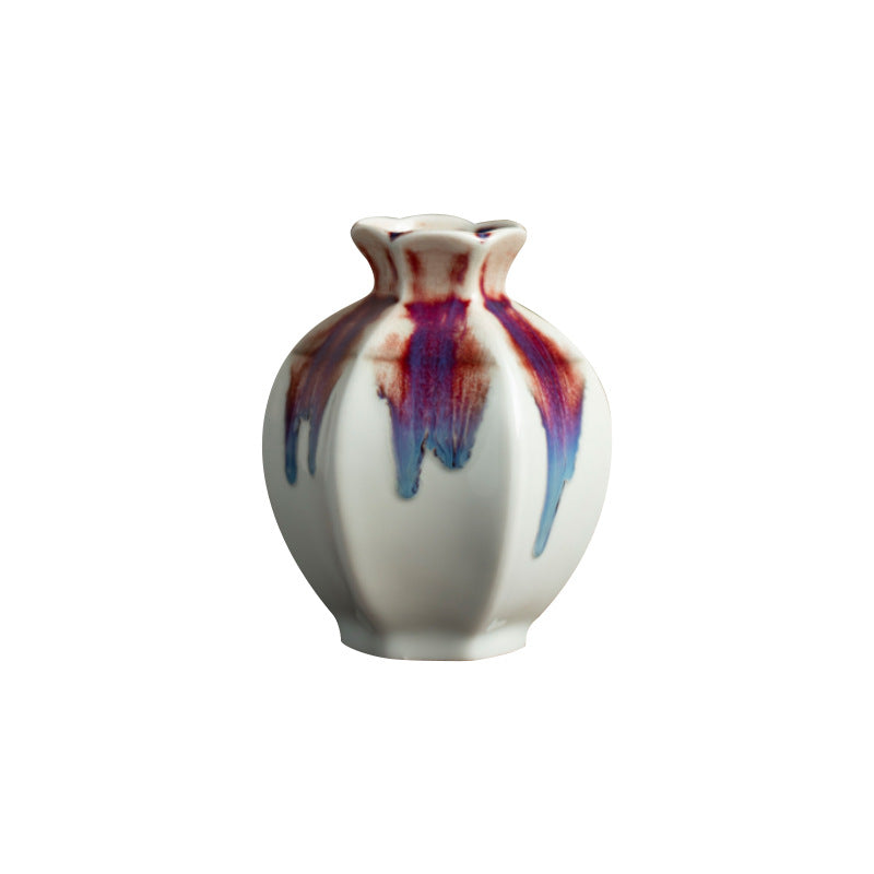 White ceramic bud vase with burgundy violet blue drip glaze isolated view