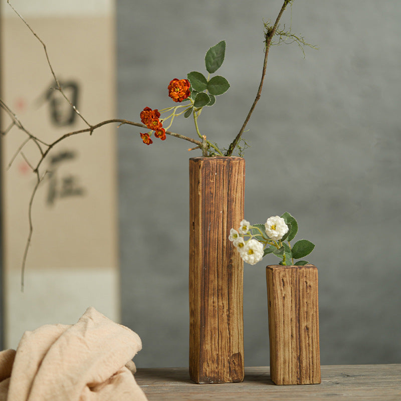 Large and small faux wood grain ceramic bud vases with branch arrangements