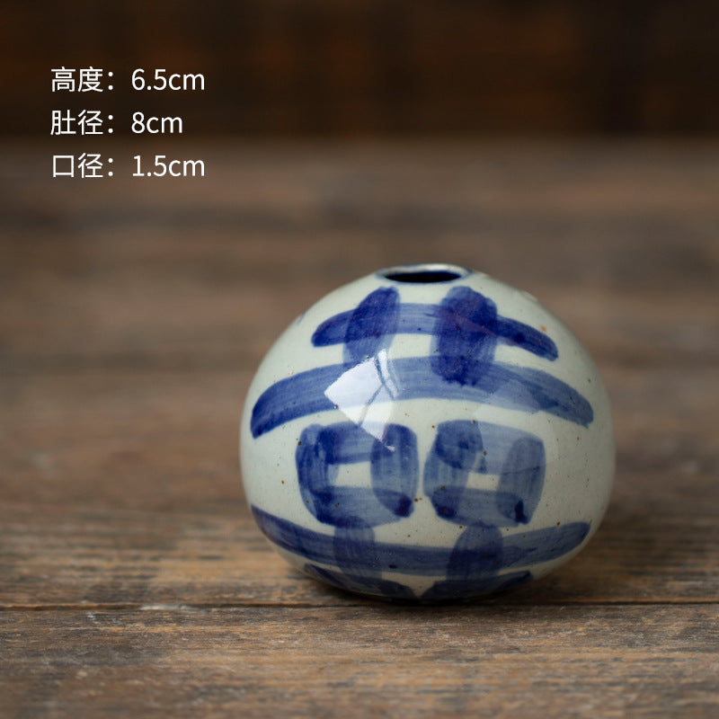 Hand-painted blue white round ceramic bud vase with geometric motif, 6.5 cm
