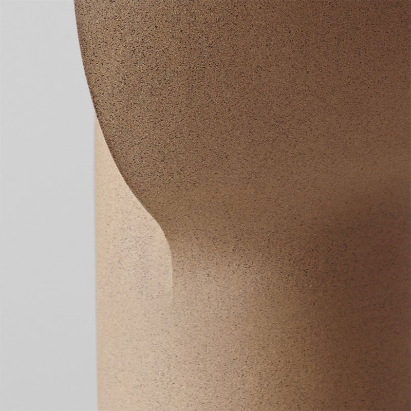 Textured sand beige resin sculptural table lamp surface detail