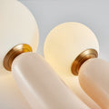Dual globe sculptural table lamp with warm white glass spheres and gold accents