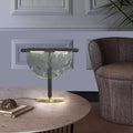 Amber half moon artisan glass table lamp with slim black metal frame and brass base