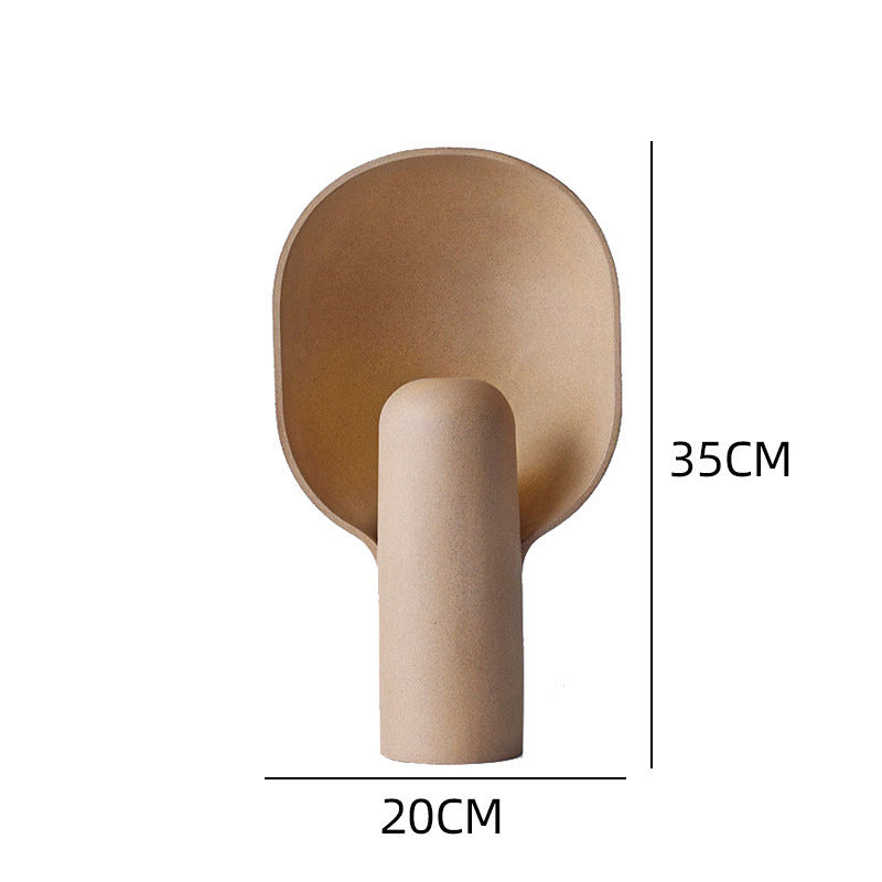 Sand beige sculptural resin table lamp with rounded shield diffuser