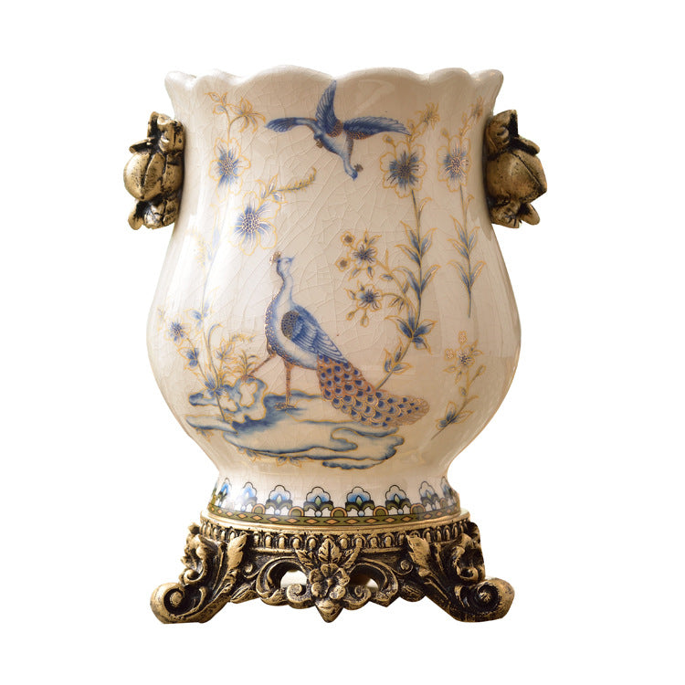 Vintage European ceramic vase with blue bird and botanical pattern, ornate bronze-tone resin accents