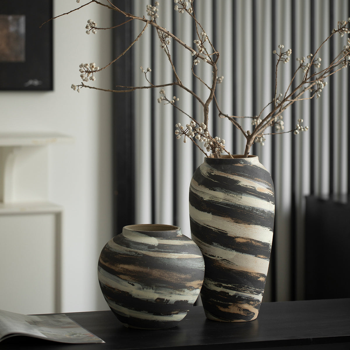 Rounded and tall rustic striped ceramic vases styled together
