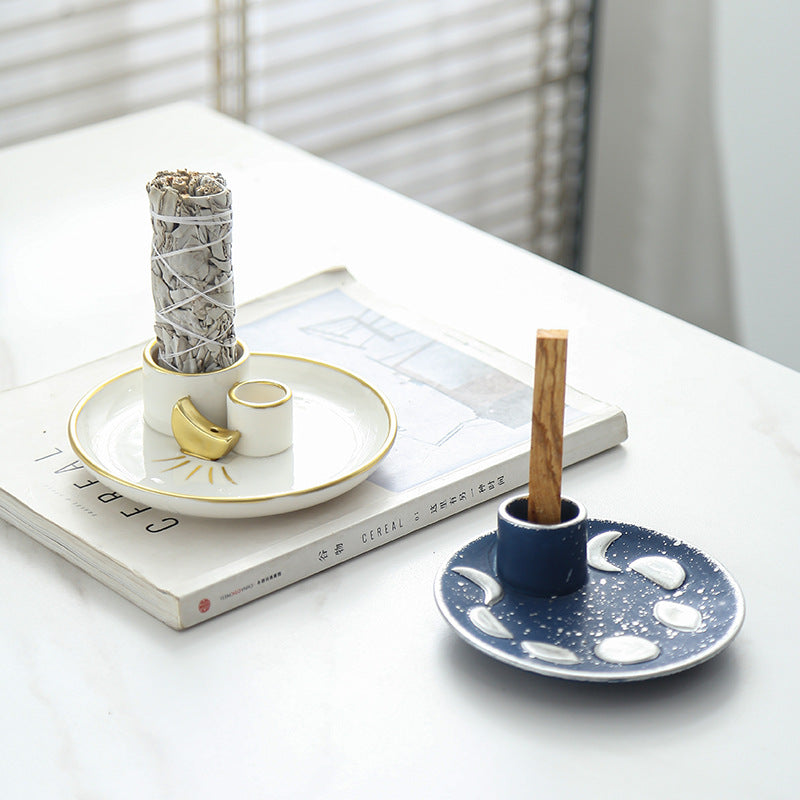 Ivory gold and midnight blue ceramic ritual trays styled with sage and Palo Santo