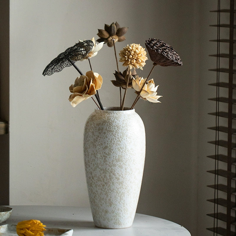 Tall ivory white crackle ceramic vase with dried floral arrangement