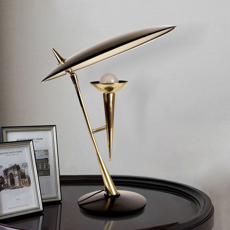 Balance table lamp with white glass globe and gold metal structure