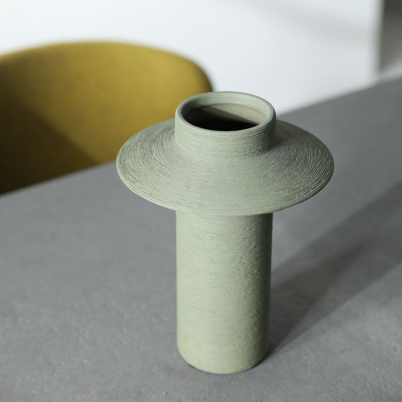 Sage green textured disc-collar ceramic vase close-up