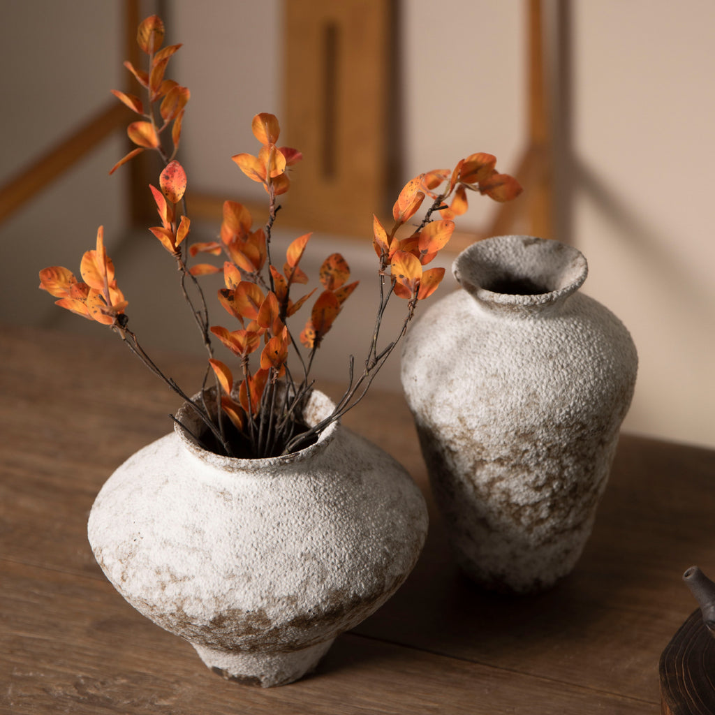 Weathered white brown ceramic vase pair with autumn branches