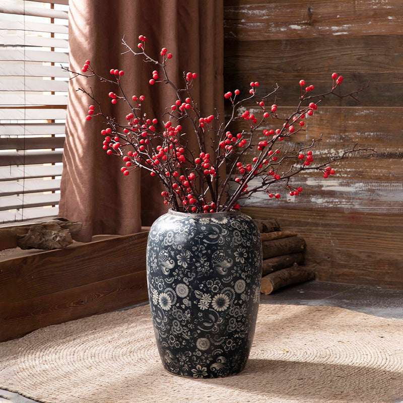 Indigo floral ceramic vase with red berry branches