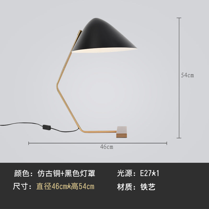 Postmodern black cone shade and gold angular frame bedside lamp