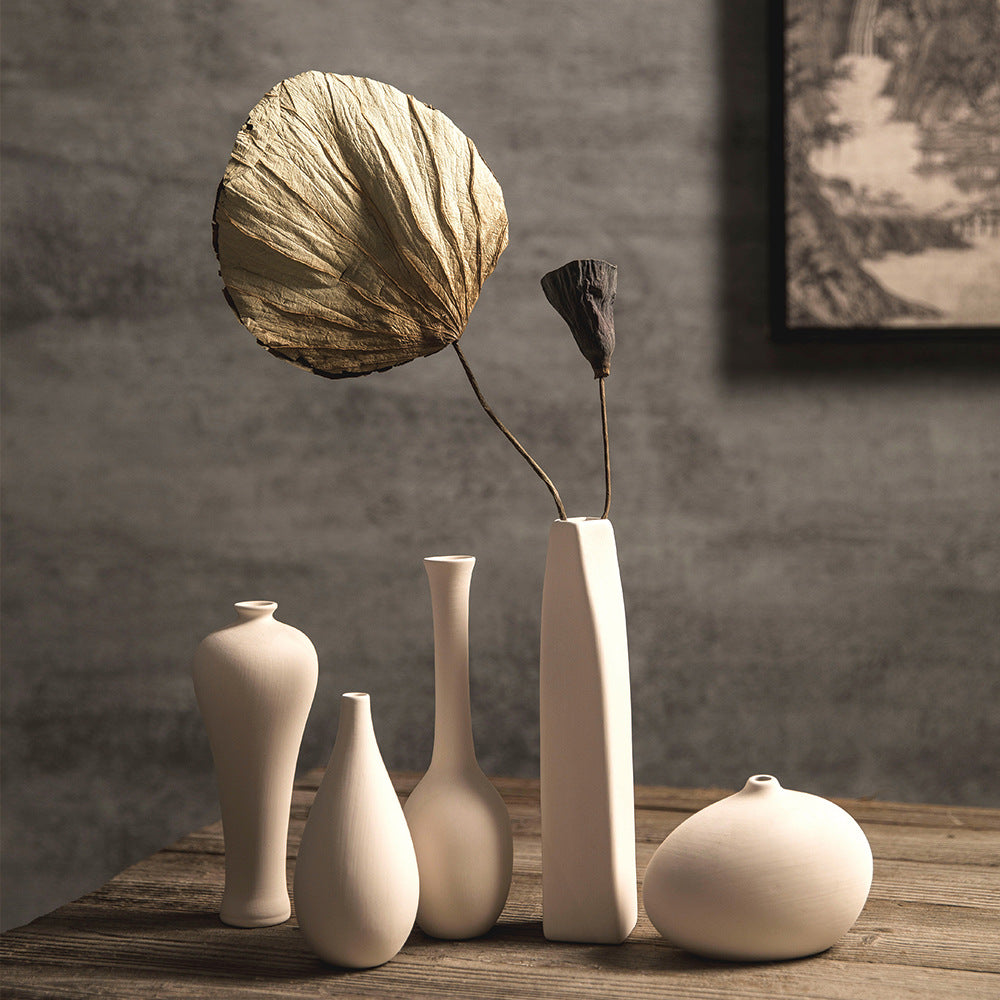 Matte ivory mini Zen ceramic vase collection styled with dried lotus