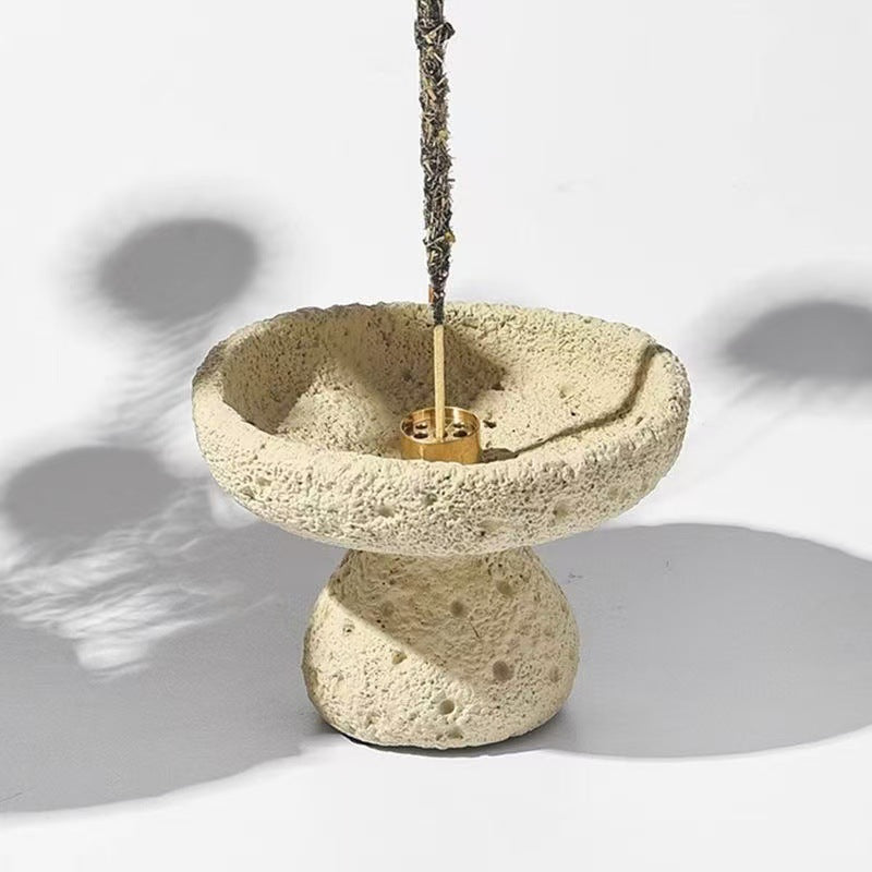 Sand beige textured incense bowl holding a burning incense stick