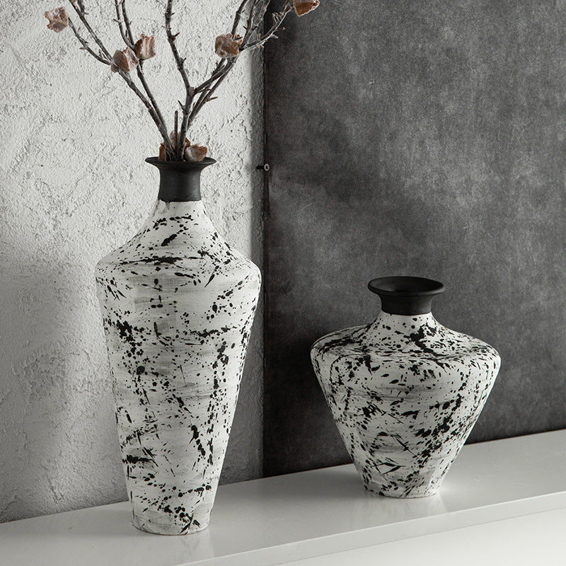 Black and white splatter ceramic tall and medium vases styled with branches