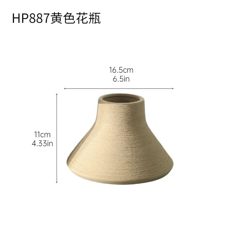Sand yellow conical textured ceramic vase, 11 cm high and 16.5 cm wide