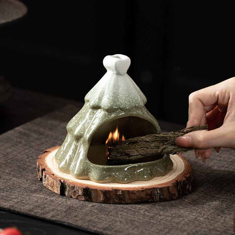 Christmas tree ceramic fireplace burner holding Palo Santo sacred wood