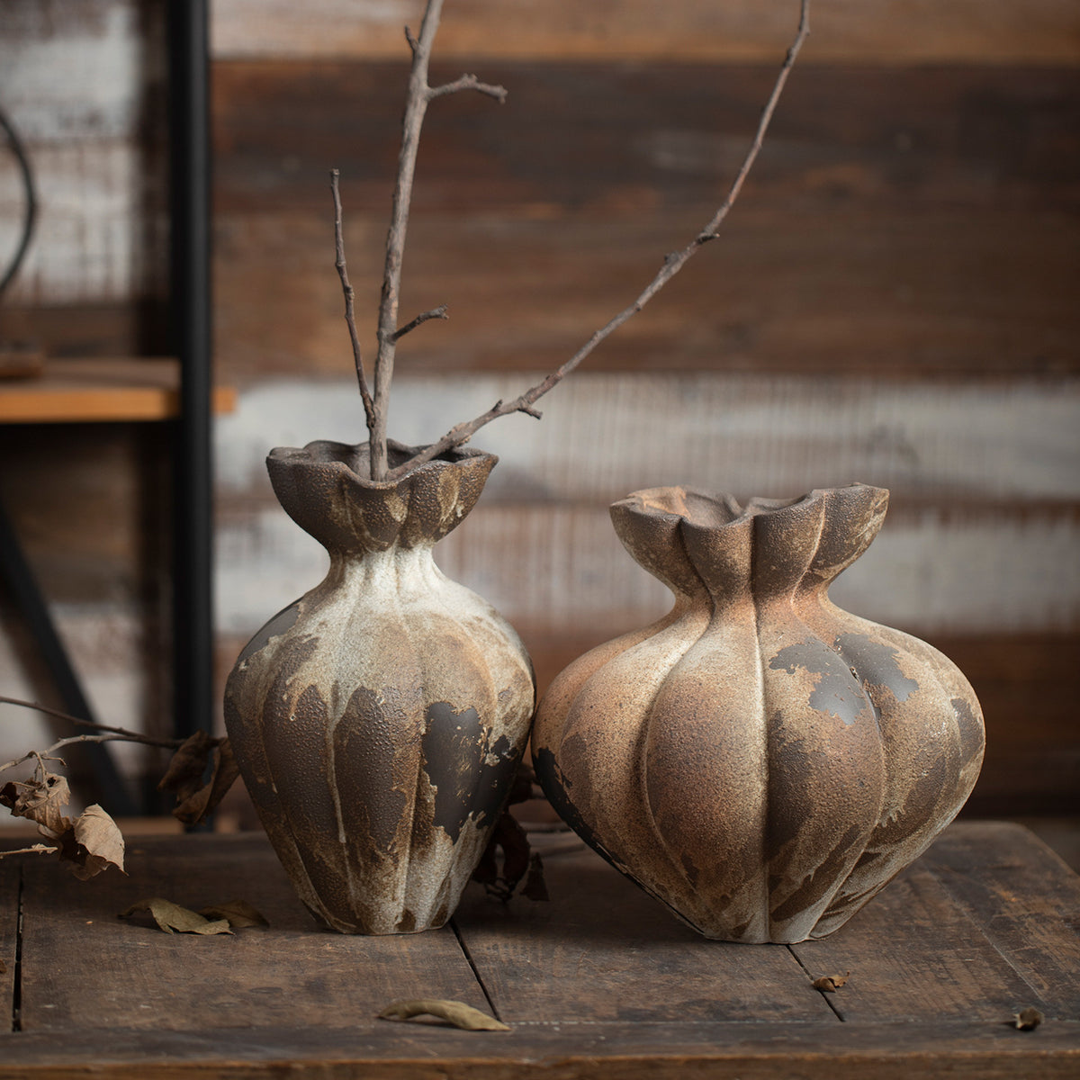 Aged rust brown fluted ceramic vase pair with branches