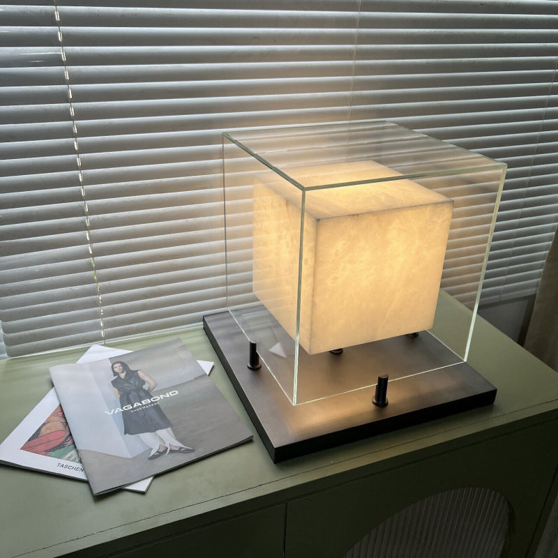 Glass cube table lamp styled on modern console table