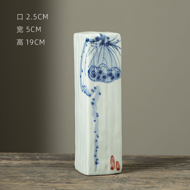 Hand-painted blue white rectangular ceramic bud vase with lotus motif, 19 cm