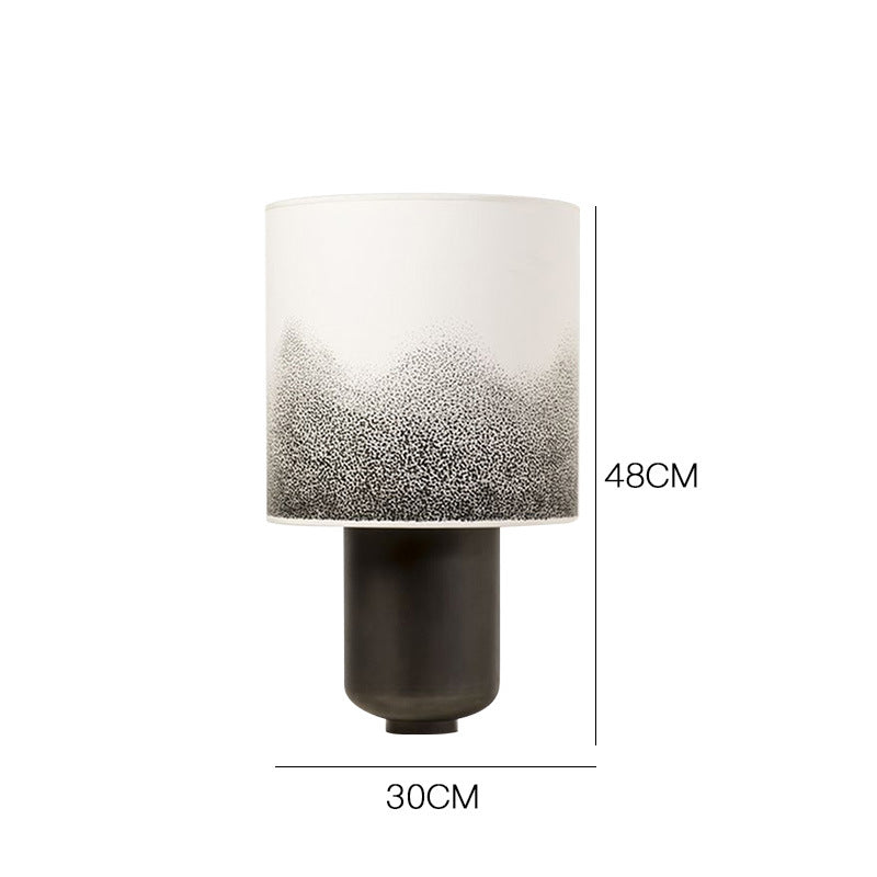 Speckled gradient shade table lamp styled on dark wood console