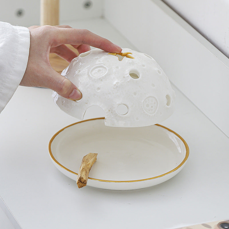 Removable perforated ceramic dome over round incense and sacred wood tray