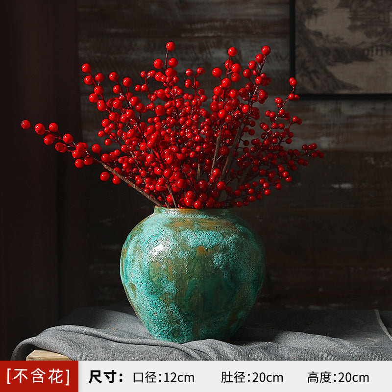 Small rounded green patina ceramic vase 20 cm with red berry branches
