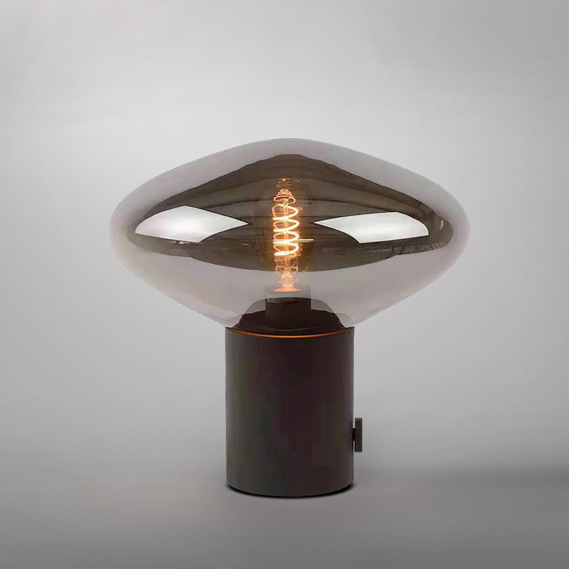 Black metal and smoke grey glass saucer table lamp side view