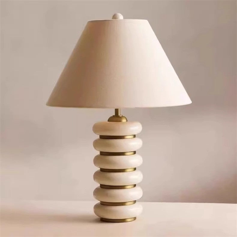 Cream stacked disc table lamp with ivory fabric shade
