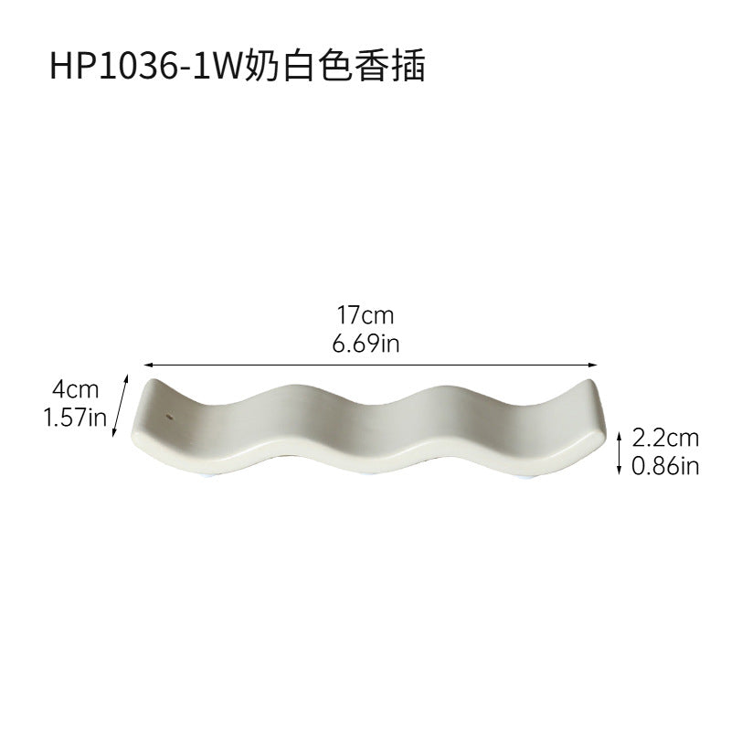 Milk white wavy ceramic incense tray approximately 17 cm long