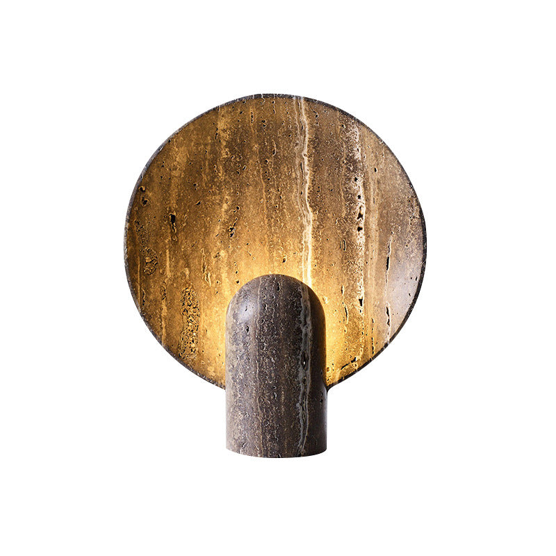 Round stone eclipse table lamp illuminated front view