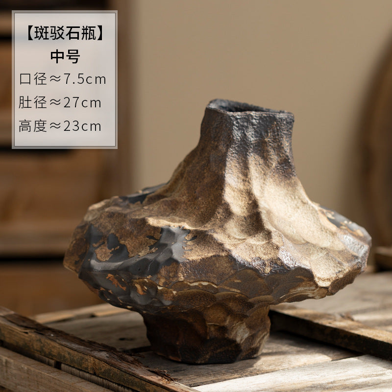Small irregular black and bronze rock-textured ceramic vase 16 cm high