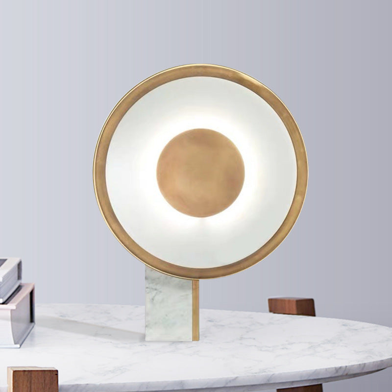Gold halo ring marble table lamp styled on stone console