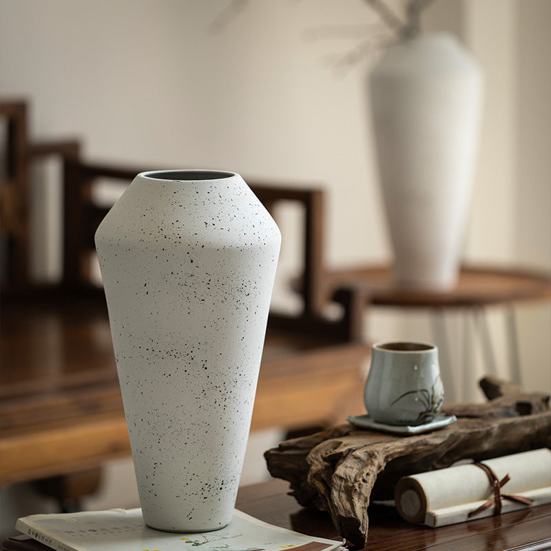 Ivory white speckled faceted ceramic vase in wabi-sabi interior