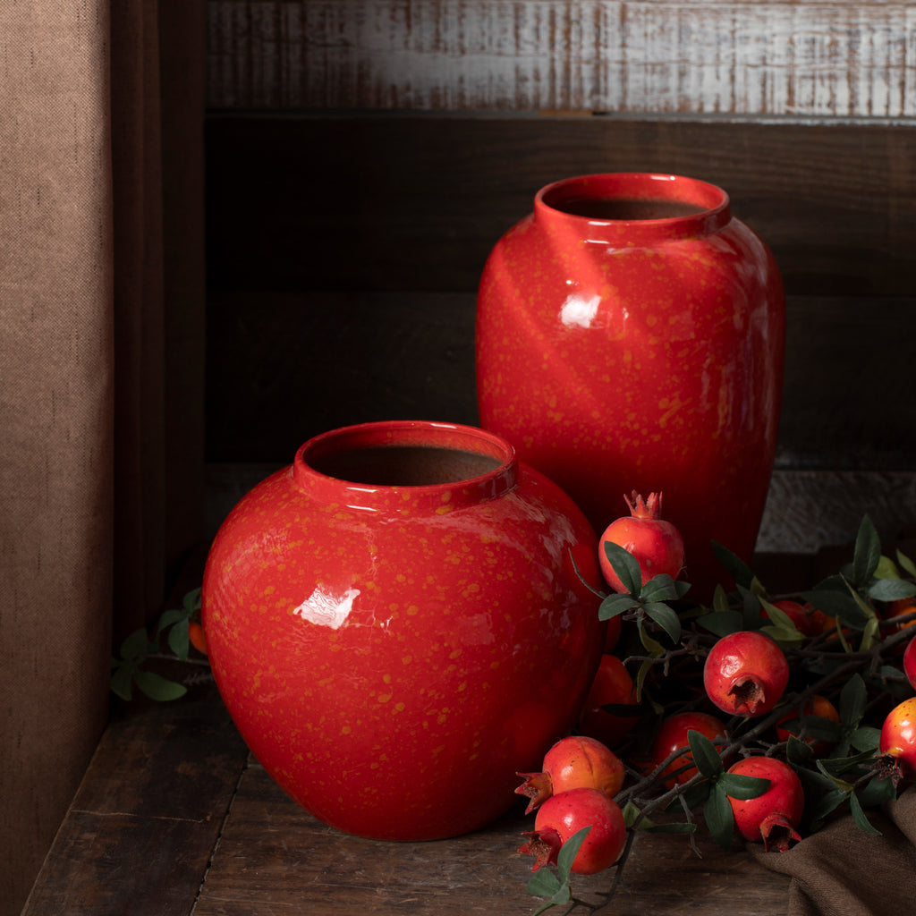 Red gold-speckled ceramic vases with pomegranate branches