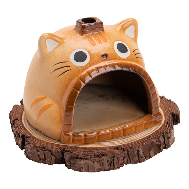 Orange tabby cat ceramic ritual fireplace with wood slice base