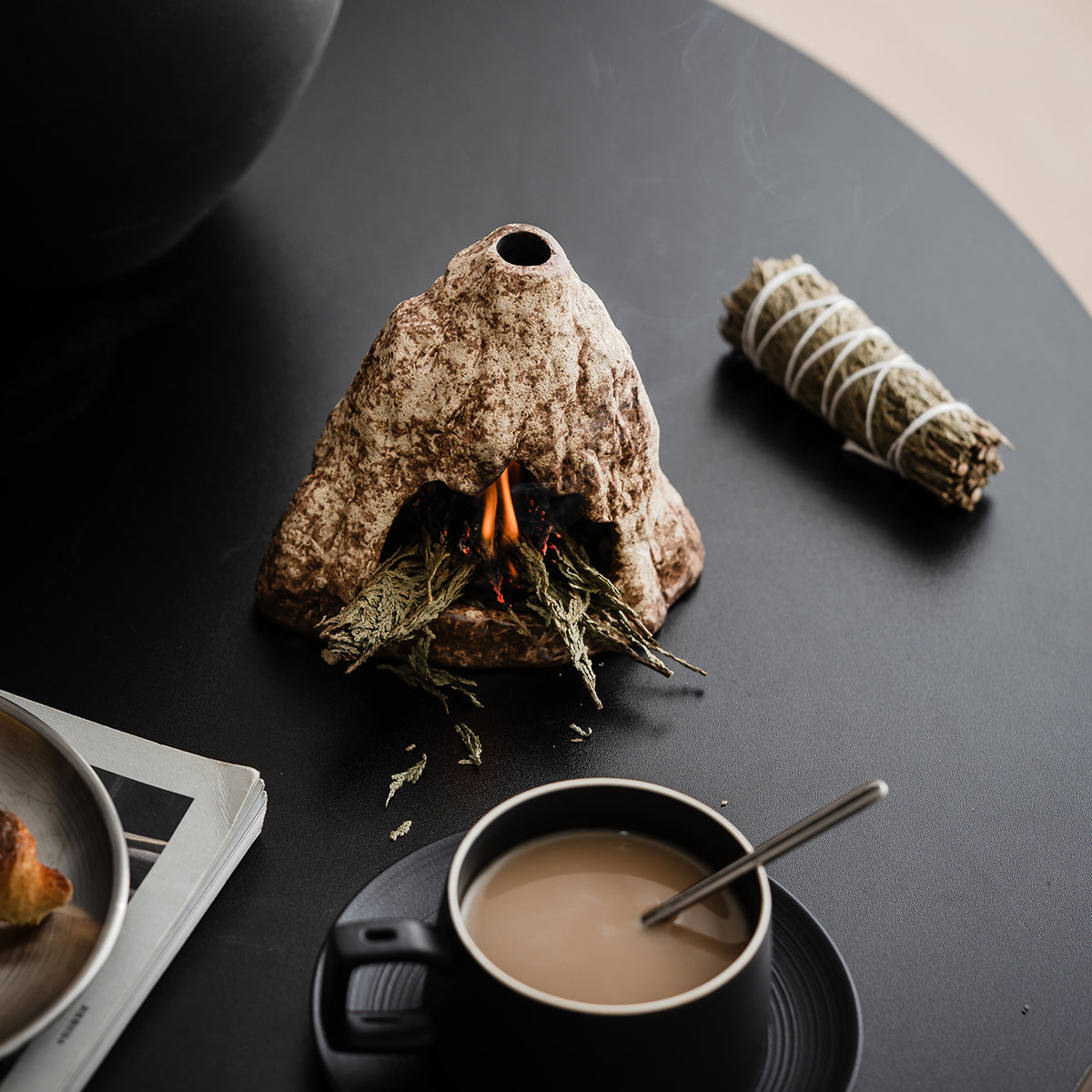 Mountain cave ceramic ritual burner used with sage in modern interior