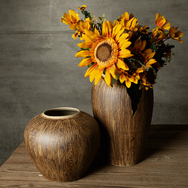 Bronze brown brushed ceramic vase pair styled with sunflowers
