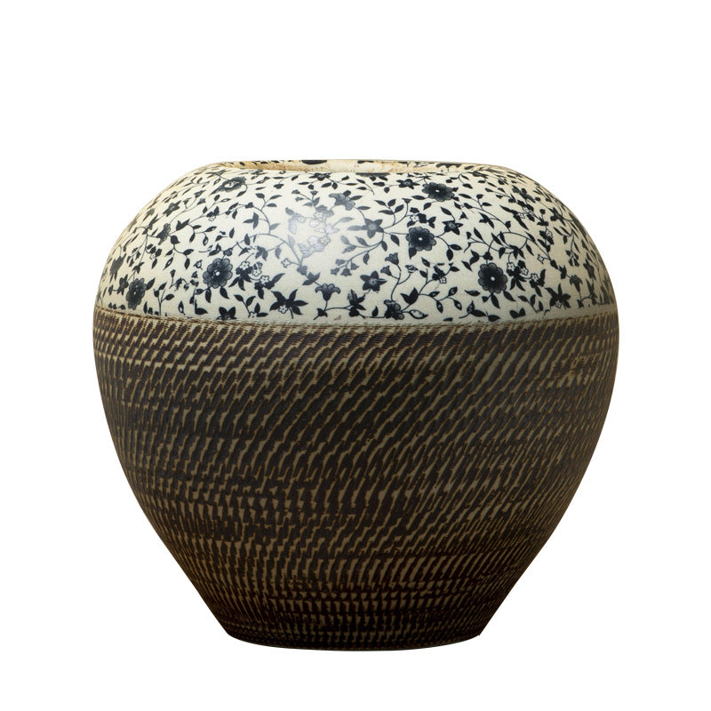 Rounded blue floral and dark carved ceramic jar isolated product view
