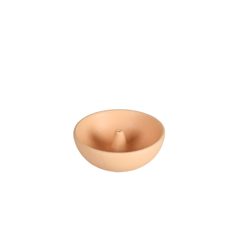 Light coffee round ceramic incense holder isolated on white background