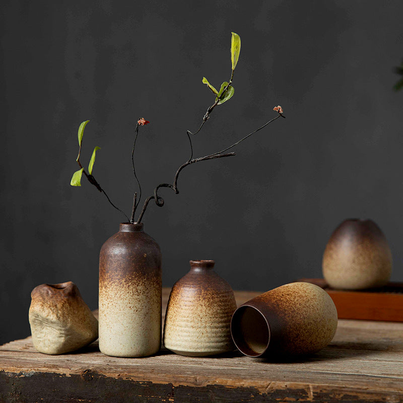 Mini wabi-sabi ceramic bud vases in mixed rounded shapes