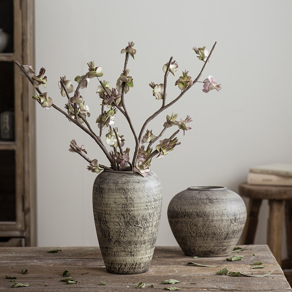 Medium and small rustic weathered ceramic vases with blossom branches