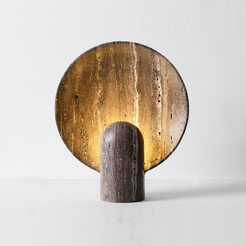 Brown travertine eclipse table lamp glowing warm backlight
