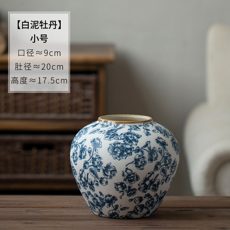 Small rounded blue and white floral ceramic vase 17.5 cm high