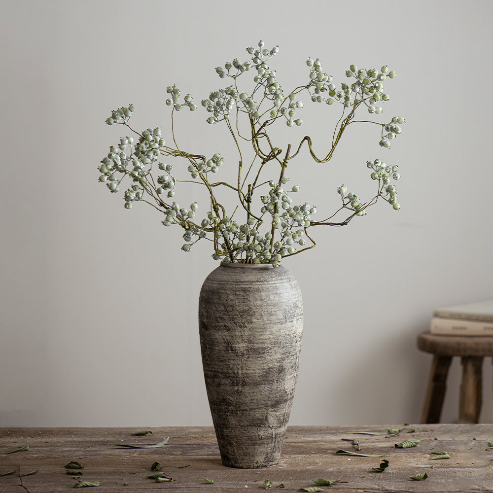 Medium weathered grey ceramic vase with airy branch arrangement